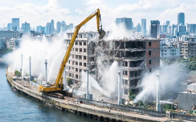 High-reach excavator urban demolition site