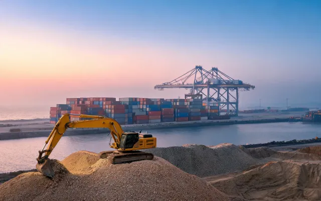 Port stockyard excavator and RTG crane operations